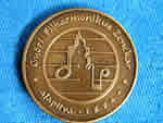 PPhoto of the back of the medal that was given to Harold Schiffman in 2001, when he was designated an Honorary Visitor of the City of Győr.